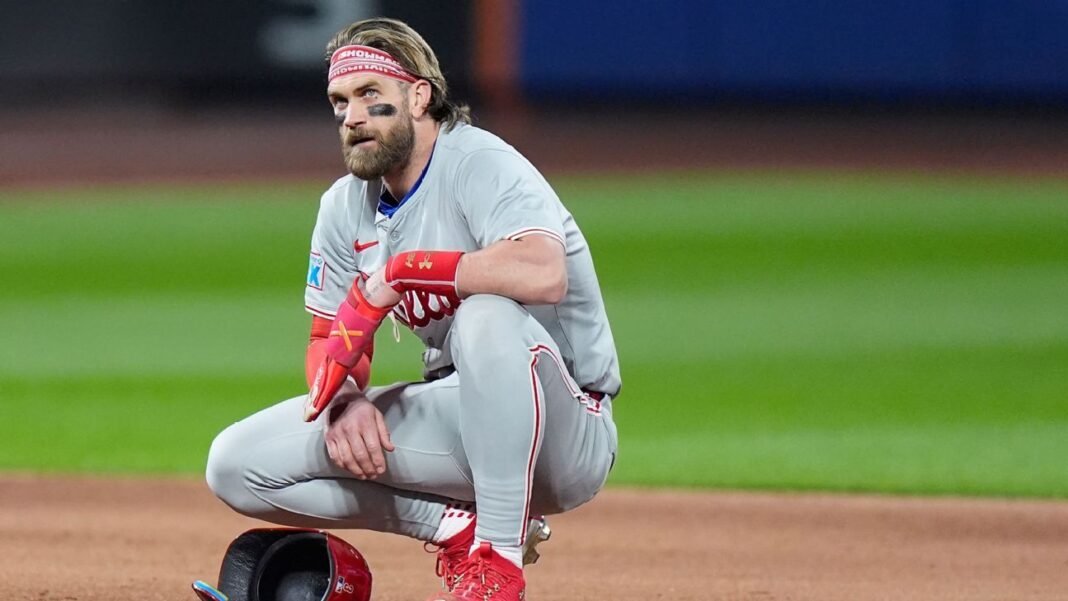 It appears that there's a report about a heated exchange between Philadelphia Phillies' player Bryce Harper and MLB Commissioner Rob Manfred. According to the sources, Harper cussed out Manfred in a meeting. 

Can you provide more context about this meeting, such as what it was about and when it took place? This would help me better understand the situation and provide a more informed response.