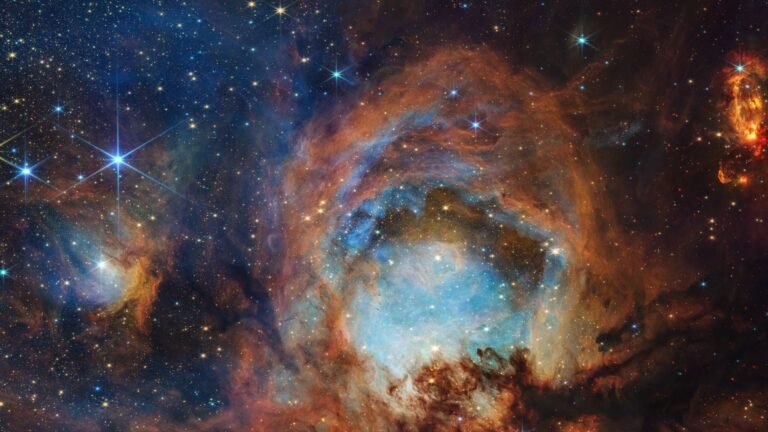 The James Webb Space Telescope (JWST) has marked its third year of operational science with a stunning image of the Cat's Paw Nebula, showcasing its remarkable capabilities. The image, which has been dubbed 'toe beans' due to its resemblance to a cat's paw, features intricate details and vibrant colors, highlighting the telescope's advanced technology.

The Cat's Paw Nebula, located in the constellation Scorpius, is a vast star-forming region that is home to numerous young stars and planetary systems. The JWST's image captures the nebula's complex structure, which includes dense gas and dust, as well as the presence of hot, young stars that are sculpting the surrounding material.

The 'toe beans' image is a composite of multiple observations made by the JWST, using its Near-Infrared Camera (NIRCam) and Mid-Infrared Instrument (MIRI). The telescope's advanced instrumentation and sensitive detectors allow it to peer through the dust and gas that obscures the nebula, revealing the underlying structure and activity.

The release of this image marks a significant milestone for the JWST, which has been operational since July 2022. Over the past three years, the telescope has made numerous groundbreaking discoveries, including the detection of water vapor on a distant exoplanet, the observation of the most distant galaxy ever seen, and the study of the formation of stars and planetary systems in the early universe.

The JWST's continued operation and remarkable images like the 'toe beans' of the Cat's Paw Nebula are a testament to the power of human ingenuity and the importance of space exploration. As the telescope continues to explore the universe and push the boundaries of our understanding, it is likely to make many more exciting discoveries that will shape our knowledge of the cosmos.
