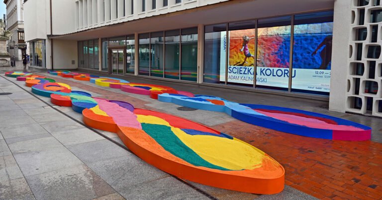 The "Color Path" public art installation in Poland features a large-scale design made from tons of colored aggregates. The aggregates, which are small pieces of stone, glass, or other materials, are arranged in a specific pattern to create a vibrant and visually striking path.

The installation is likely made up of a mixture of different colored aggregates, such as crushed stone, glass, or ceramic, which are carefully placed to create a unique and intricate design. The use of colored aggregates allows for a high level of customization and creativity, as the colors and patterns can be tailored to fit the specific vision of the artist or designer.

The "Color Path" installation may serve several purposes, such as adding aesthetic value to a public space, creating a sense of community and interaction among visitors, or even providing a functional path for pedestrians. The use of colored aggregates also allows for a durable and low-maintenance installation, as the materials are resistant to weathering and can withstand heavy foot traffic.

Overall, the "Color Path" public art installation in Poland is a unique and engaging example of how colored aggregates can be used to create a visually striking and interactive public space.
