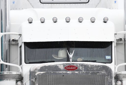 <p>The Federal Motor Carrier Safety Administration (FMCSA) has been considering changes to the Hours of Service (HOS) regulations, which could significantly impact small carriers' profitability. Here's one way it can affect them:</p>
<p><strong>Increased Flexibility vs. Increased Costs</strong></p>
<p>One potential change is to provide more flexibility in the HOS rules, such as allowing drivers to split their sleeper berth time or extending the 14-hour on-duty window. This could benefit small carriers by:</p>
<ol>
<li><strong>Reducing fatigue</strong>: More flexibility in scheduling could help drivers get the rest they need, reducing the risk of fatigue-related accidents and improving overall safety.</li>
<li><strong>Increasing productivity</strong>: With more flexibility, drivers might be able to complete their routes more efficiently, potentially increasing the number of deliveries or loads they can handle.</li>
</ol>
<p>However, these changes could also lead to:</p>
<ol>
<li><strong>Higher labor costs</strong>: If drivers are allowed to work more flexible hours, they may need to be paid for more time, including potential overtime, which could increase labor costs for small carriers.</li>
<li><strong>Increased administrative burdens</strong>: Small carriers may need to invest in new technology or staff to manage the complexities of the revised HOS rules, adding to their administrative costs.</li>
<li><strong>Potential impact on equipment utilization</strong>: Changes to HOS rules could lead to more frequent stops or alterations in route planning, which might affect the utilization of equipment, potentially increasing maintenance costs or decreasing the lifespan of vehicles.</li>
</ol>
<p><strong>Small Carriers' Profitability Concerns</strong></p>
<p>Small carriers, which often operate on thinner margins than larger carriers, may be disproportionately affected by these changes. They may struggle to absorb the increased costs associated with the revised HOS rules, potentially leading to:</p>
<ol>
<li><strong>Reducedn profitability</strong>: Higher labor and administrative costs could erode small carriers' profit margins, making it more challenging for them to remain competitive.</li>
<li><strong>Decreased competitiveness</strong>: If small carriers are unable to pass on the increased costs to their customers, they may become less competitive in the market, potentially leading to a loss of business or even closure.</li>
</ol>
<p>To mitigate these potential impacts, small carriers should:</p>
<ol>
<li><strong>Closely monitor regulatory developments</strong>: Stay up-to-date with the latest information on HOS rule changes and their potential effects.</li>
<li><strong>Assess operational efficiencies</strong>: Evaluate their current operations and identify areas where they can optimize routes, reduce costs, and improve productivity.</li>
<li><strong>Invest in technology</strong>: Consider investing in technology, such as electronic logging devices (ELDs) and transportation management systems (TMS), to help manage the complexities of the revised HOS rules and improve overall efficiency.</li>
<li><strong>Communicate with customers and partners</strong>: Work closely with customers and partners to understand their needs and expectations, and to develop strategies for managing the potential impacts of HOS rule changes.</li>
</ol>
<p>By being proactive and prepared, small carriers can better navigate the potential changes to the HOS regulations and minimize their impact on profitability.</p>